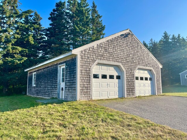 garage with a yard