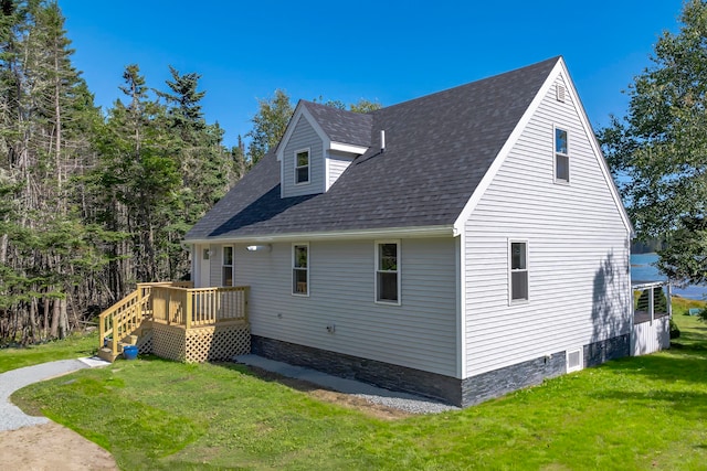 exterior space featuring a deck and a yard