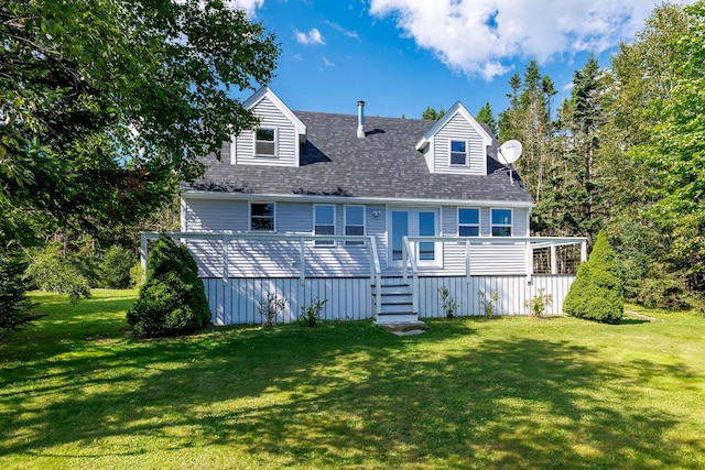 back of house with a wooden deck and a yard