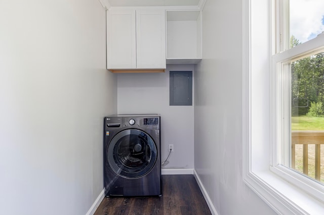 clothes washing area featuring electric panel, dark hardwood / wood-style flooring, washer / clothes dryer, and a healthy amount of sunlight