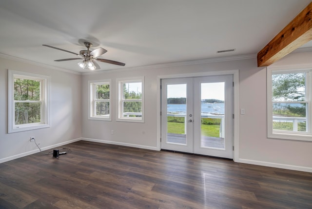 spare room with dark hardwood / wood-style floors, ceiling fan, french doors, a water view, and beamed ceiling