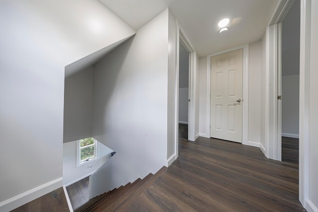 hallway featuring dark hardwood / wood-style floors