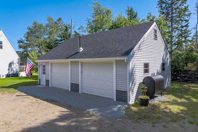 garage with a lawn