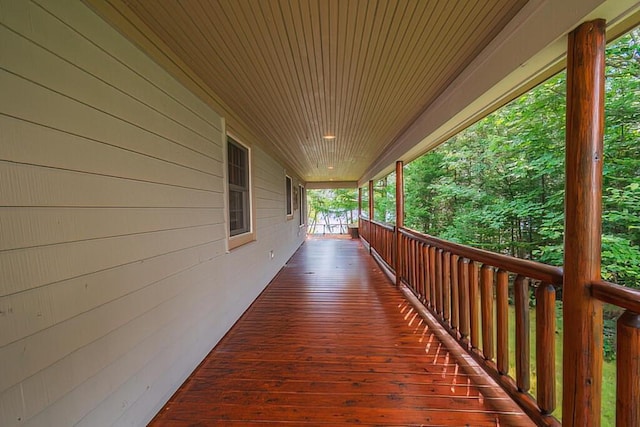 wooden terrace with a porch