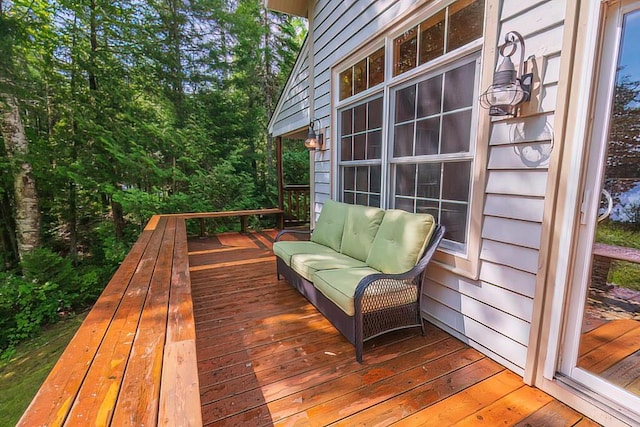 wooden deck with an outdoor hangout area