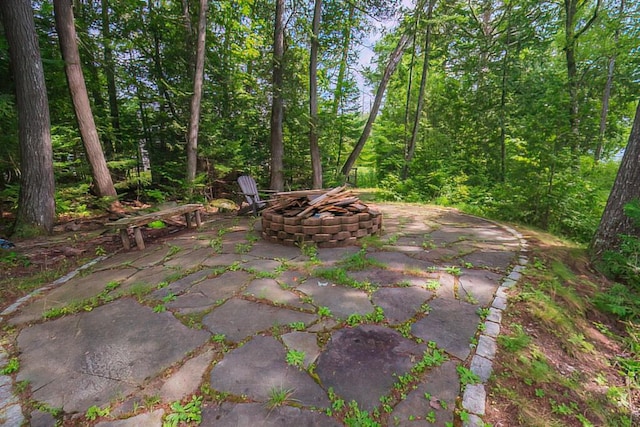 view of patio / terrace with an outdoor fire pit
