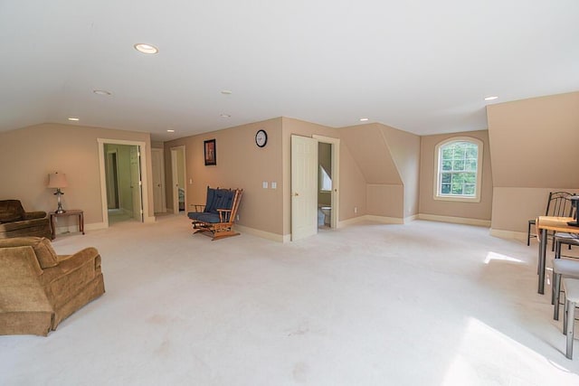 living area featuring lofted ceiling, recessed lighting, baseboards, and light colored carpet