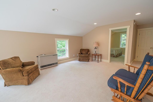 sitting room with baseboards, lofted ceiling, heating unit, carpet floors, and recessed lighting