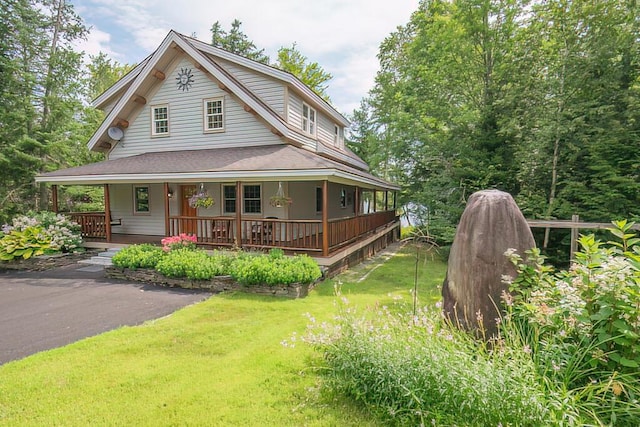 view of front of home featuring a porch and a front yard