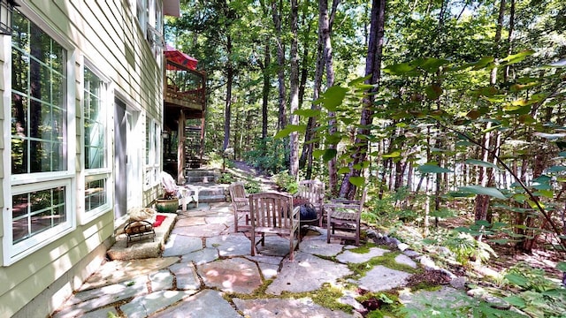 view of patio / terrace featuring an outdoor fire pit