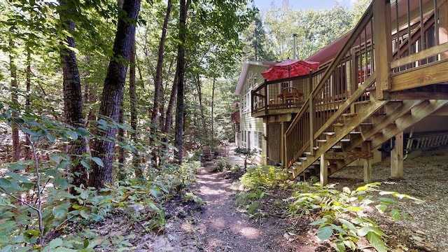 exterior space featuring stairway and a wooden deck