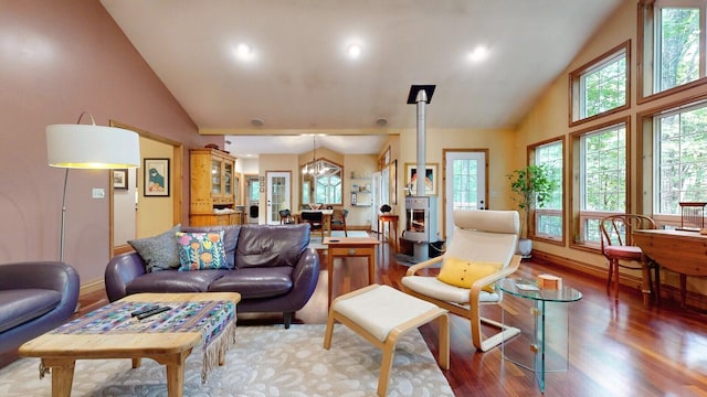 living area featuring high vaulted ceiling, recessed lighting, wood finished floors, baseboards, and an inviting chandelier