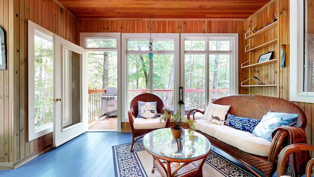 sunroom / solarium featuring wooden ceiling