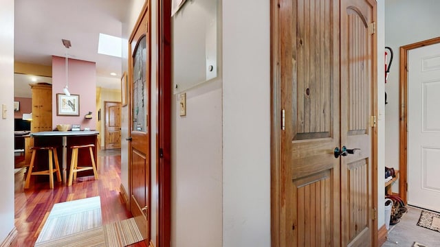 hallway featuring wood finished floors