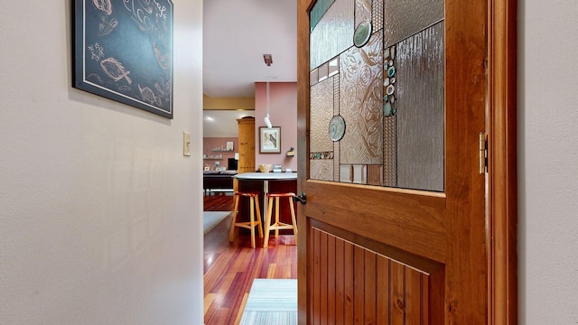 corridor featuring wood finished floors