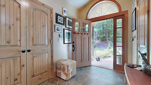 foyer entrance featuring stone tile floors