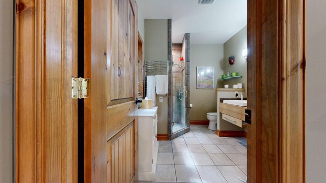 full bath featuring visible vents, toilet, tile patterned floors, vanity, and a shower stall