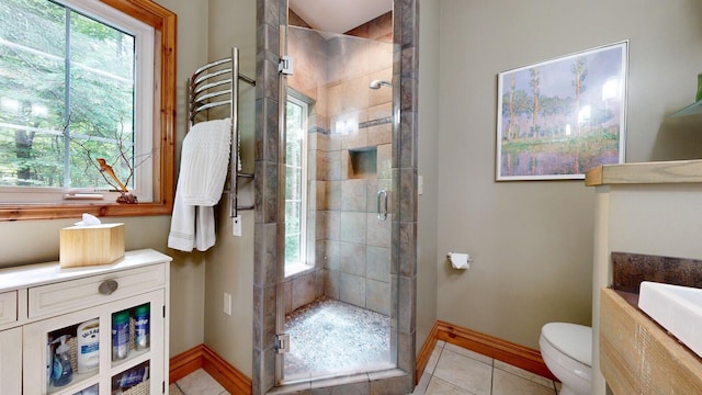 full bathroom featuring a healthy amount of sunlight, a stall shower, tile patterned flooring, and toilet