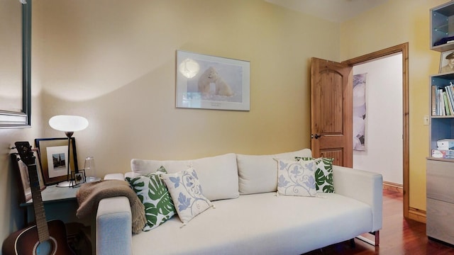 living area with baseboards and dark wood-style flooring