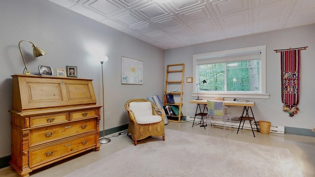 living area with a baseboard heating unit and baseboards