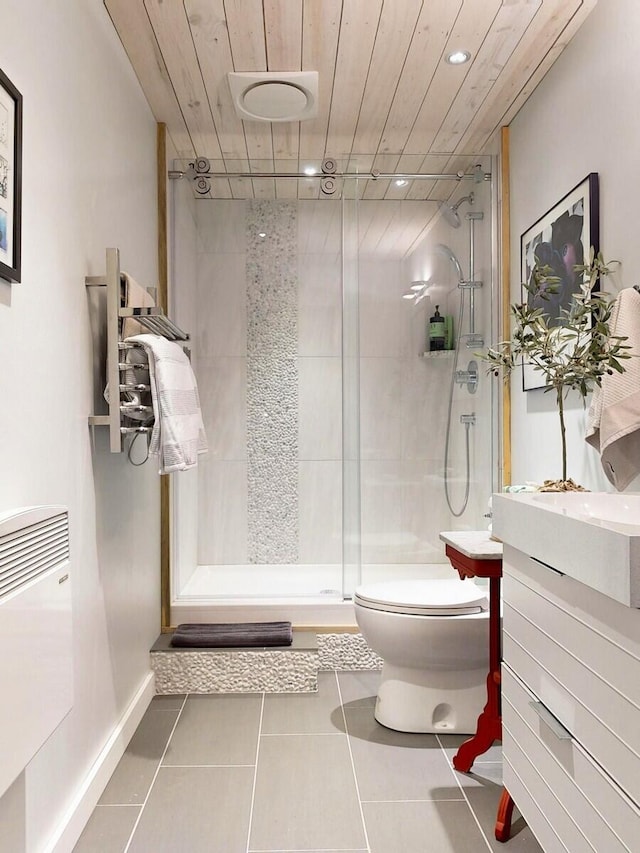 full bathroom featuring wooden ceiling, a shower stall, toilet, and tile patterned floors