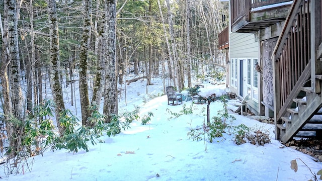 view of yard layered in snow