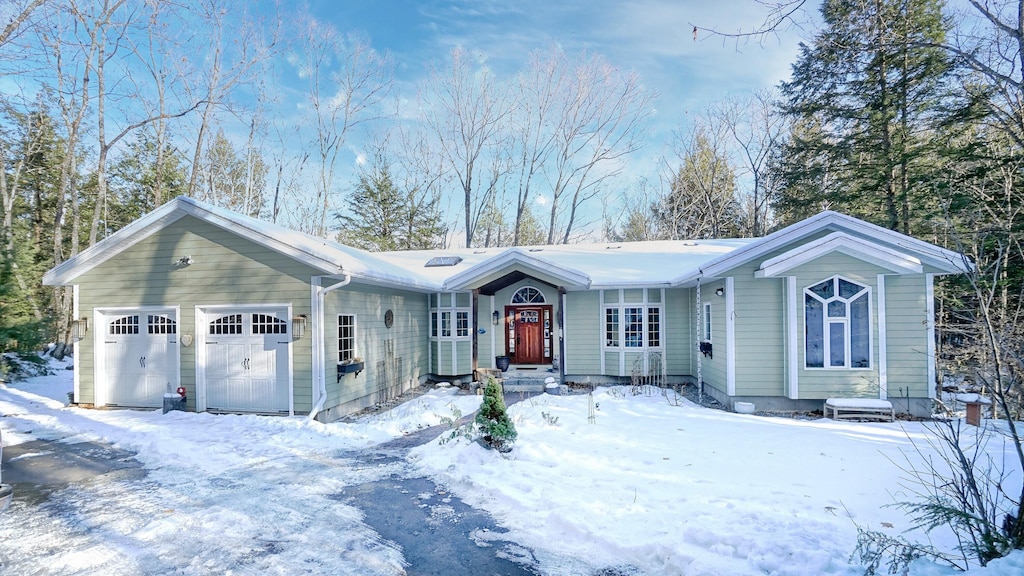 16 Knowles Point Rd, Bridgton, ME 04009 - ranch-style house featuring an attached garage