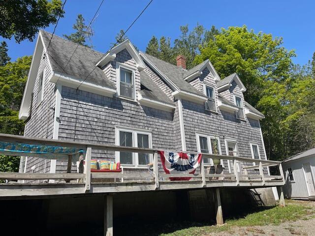 11 Sardine Way, Lubec, ME 04652 - rear view of property with a shingled roof, a chimney, and a deck