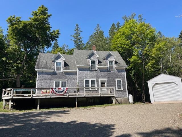 11 Sardine Way, Lubec, ME 04652 - view of front of property with an outdoor structure, a wooden deck, and a detached garage