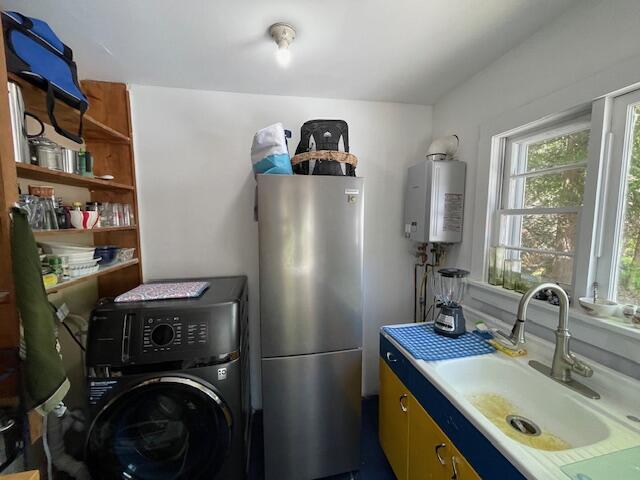 11 Sardine Way, Lubec, ME 04652 - laundry area featuring washer / dryer, tankless water heater, laundry area, and a sink