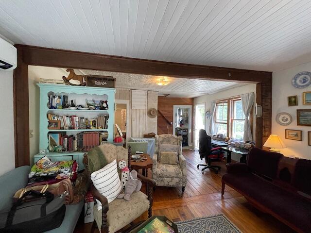 11 Sardine Way, Lubec, ME 04652 - living room featuring wood-type flooring and a wall mounted air conditioner