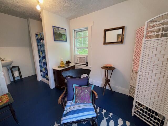 11 Sardine Way, Lubec, ME 04652 - sitting room with a textured ceiling and cooling unit