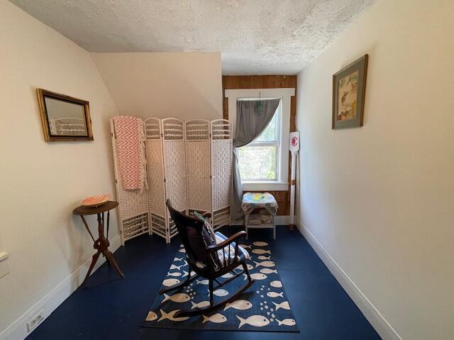 11 Sardine Way, Lubec, ME 04652 - living area with baseboards and a textured ceiling
