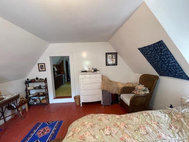 11 Sardine Way, Lubec, ME 04652 - bedroom featuring wood finished floors and lofted ceiling