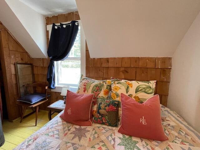 11 Sardine Way, Lubec, ME 04652 - bedroom with wooden walls and lofted ceiling