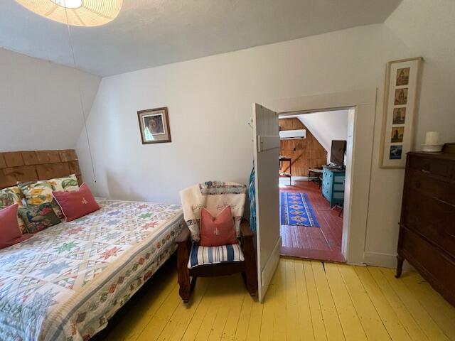 11 Sardine Way, Lubec, ME 04652 - bedroom featuring wood-type flooring and lofted ceiling
