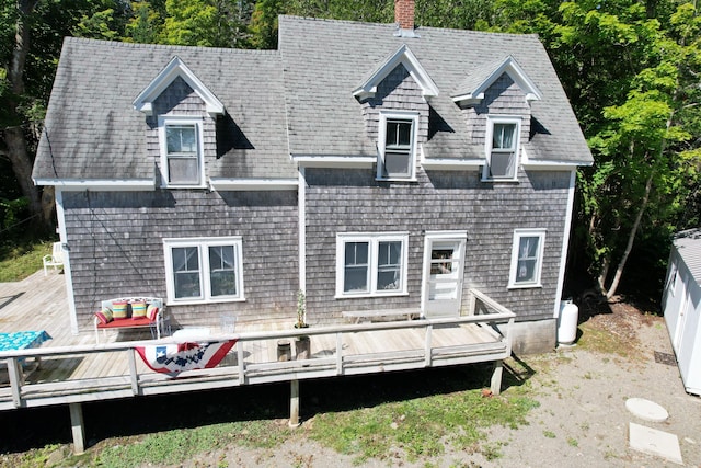 11 Sardine Way, Lubec, ME 04652 - back of property with roof with shingles, a chimney, and a deck
