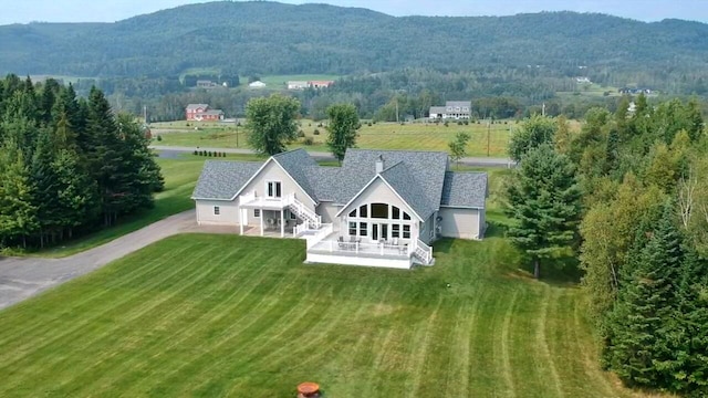 drone / aerial view featuring a mountain view