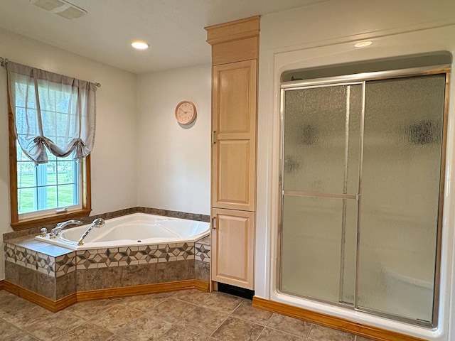 bathroom with a stall shower, tile patterned flooring, a garden tub, and visible vents