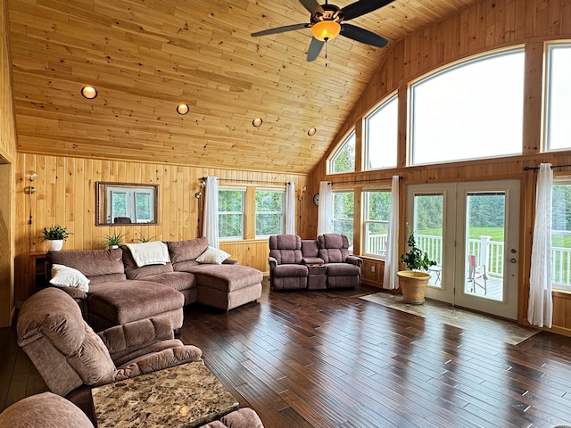 living room with high vaulted ceiling, wood ceiling, wooden walls, and dark wood-style flooring