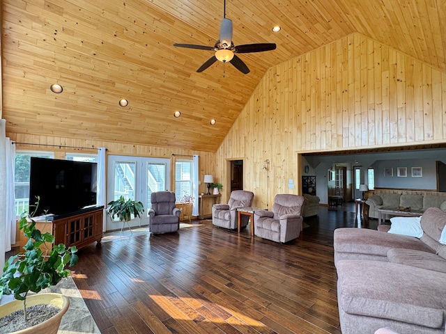 living area with wooden ceiling, hardwood / wood-style flooring, wooden walls, and high vaulted ceiling