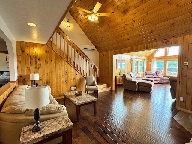 living room featuring a wall unit AC, wood walls, stairway, and dark wood-type flooring