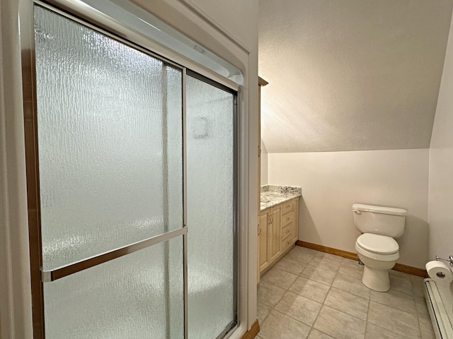 bathroom with baseboards, toilet, lofted ceiling, tile patterned flooring, and a shower stall