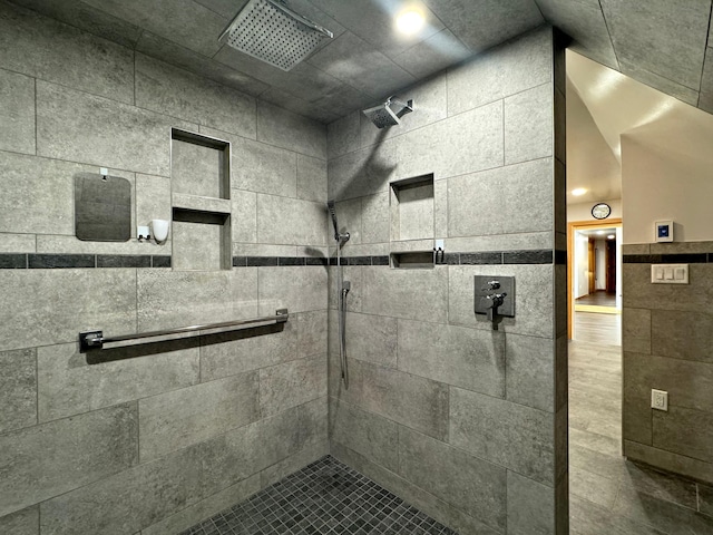 full bath featuring a tile shower