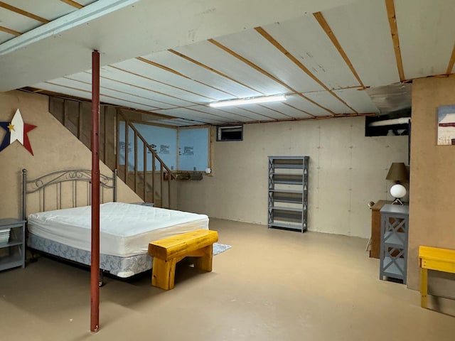 bedroom featuring finished concrete flooring