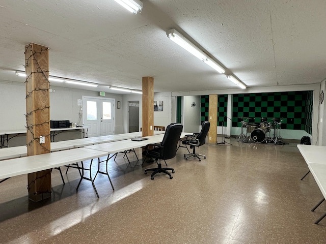 office with a textured ceiling and french doors