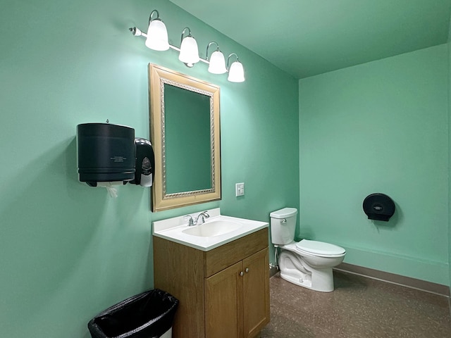 half bathroom featuring toilet and vanity