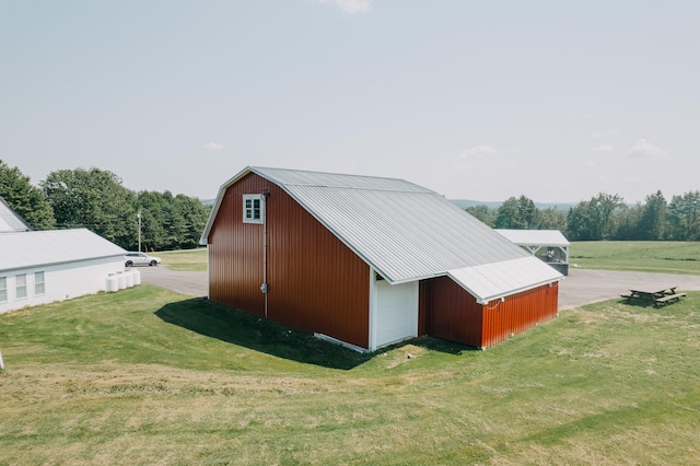 view of outbuilding with a lawn