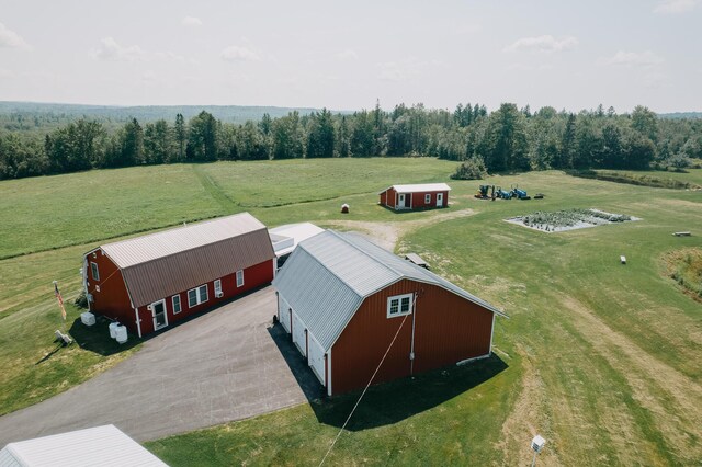 birds eye view of property featuring a rural view