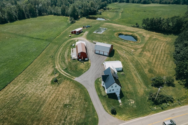 drone / aerial view featuring a water view and a rural view